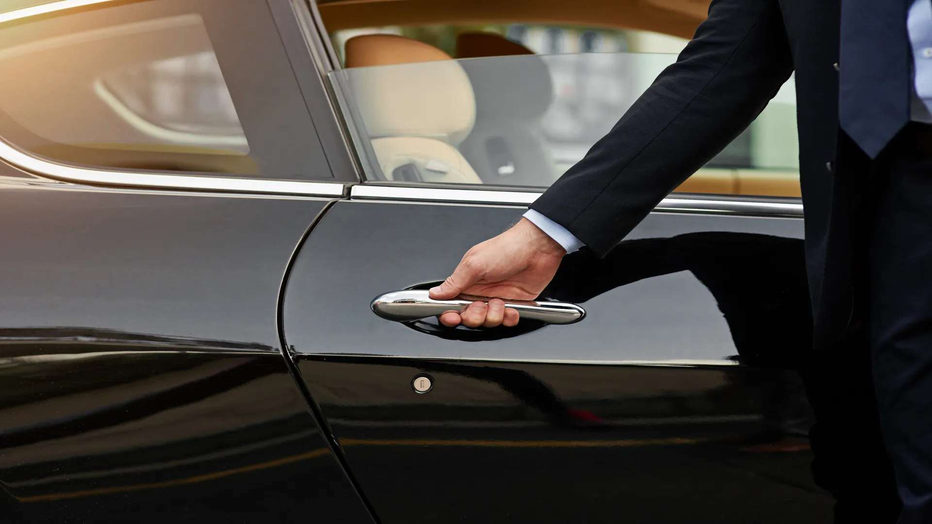 Men opening a car. Luxury rentals in Marbella